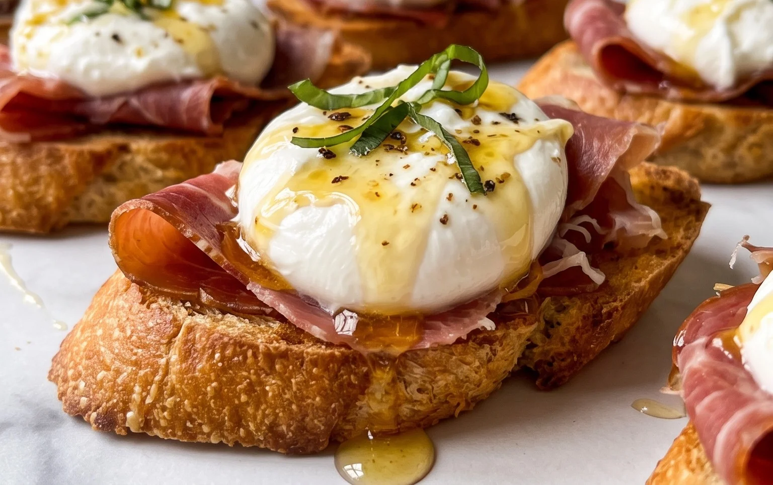Beef Prosciutto Crostini with Burrata and Lemon Honey Drizzle